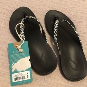 Olukai Black Kapa flip flops. Out of stock online.  These sell for $60+ new.